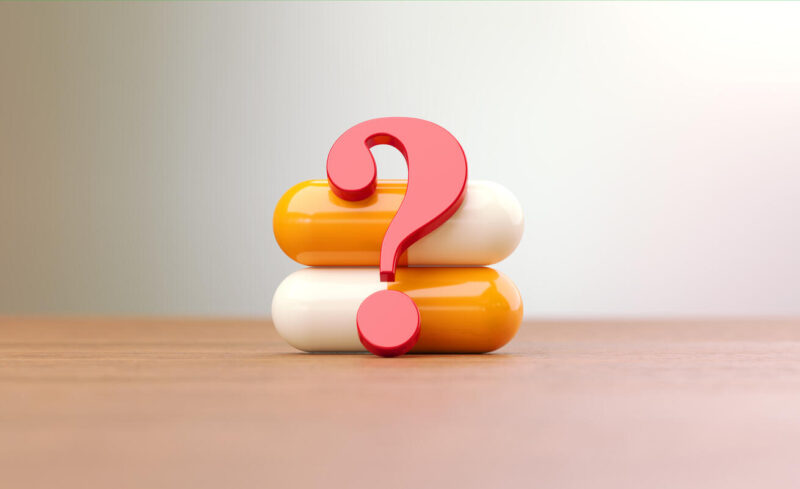 Kysymysmerkki kapselien edessä.